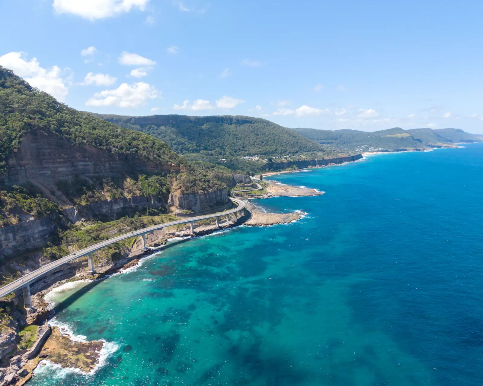 A coastal road along a cliff above the sea